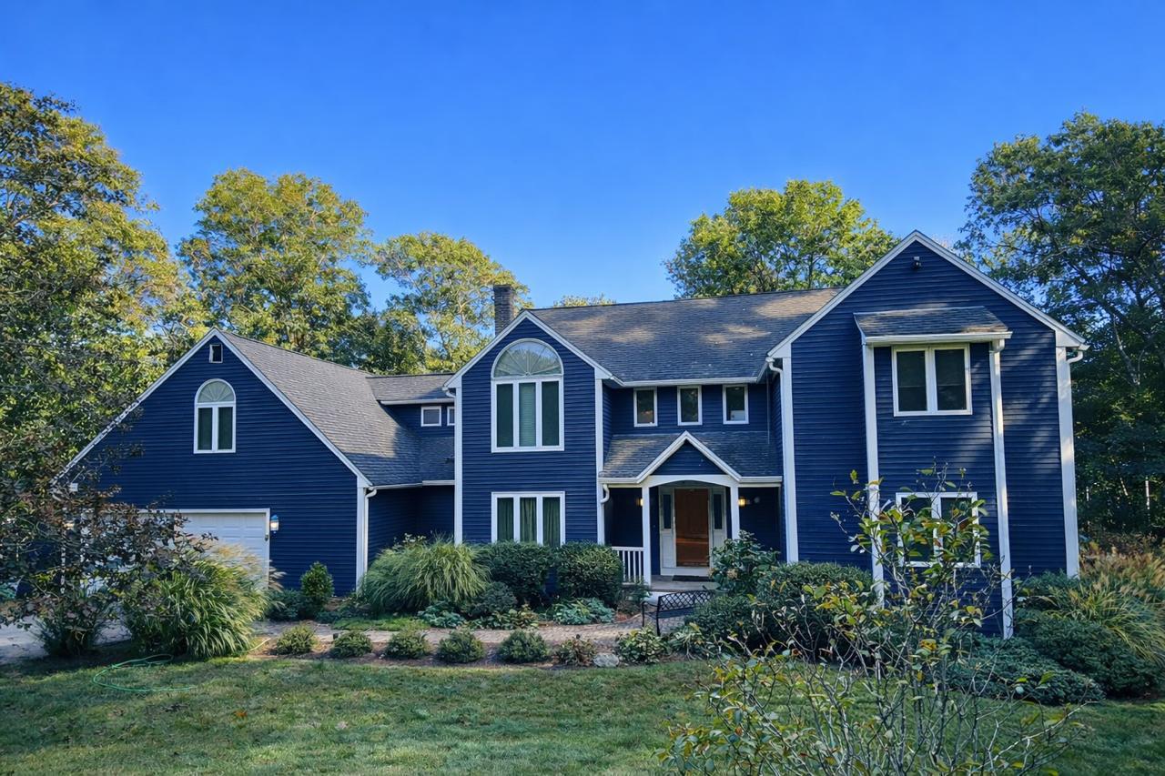 Exterior curb appeal idea with classic siding color and bold front door